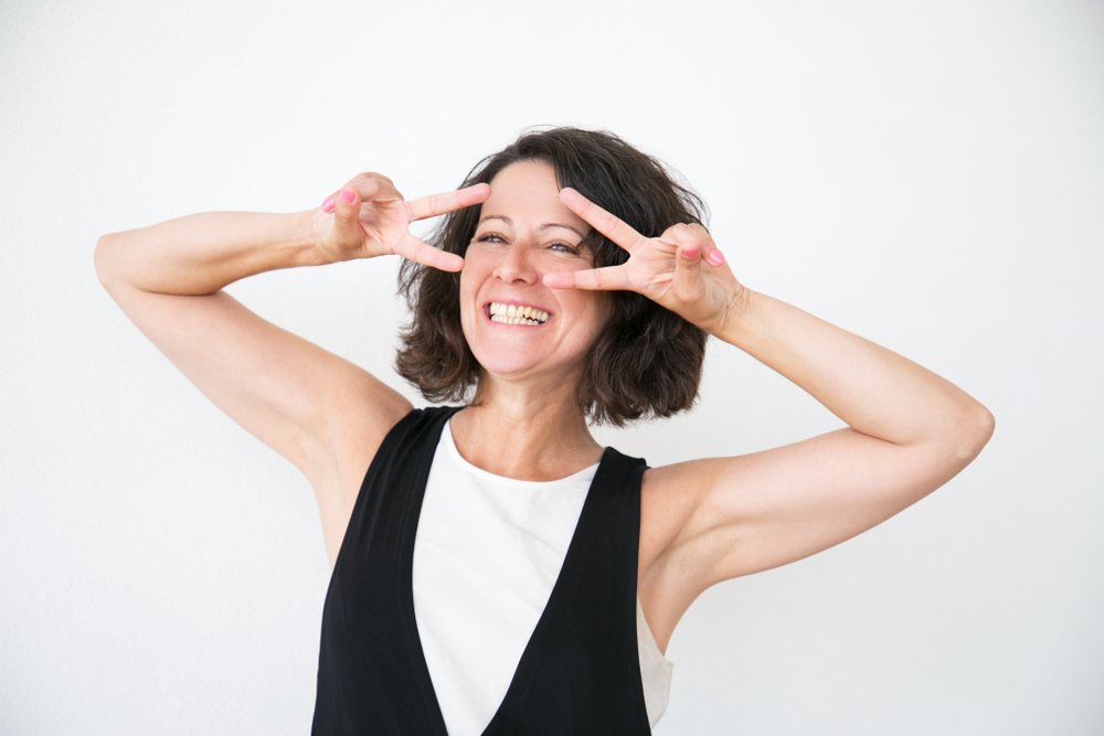 Happy Woman in Sleeveless Top with Nice Arms